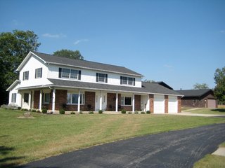 A prestigius and immaculate property on the SE edge of Bluffton sits on 5+/- partially wooded acres close to schools and state park.  Completely remodeled in 1992, the home draws you close to nature featuring two bay windows overlooking the scenic pond and beach, a large kitchen with sitting area opening to a patio overlooking the winding creek, a laundry room with new appliances and an island, a spacious master bedroom with full bath and a sitting area, a clean basement for play and storage, a heated and finished garage (fridge reserved), and a wrap porch to view the wildlife.  A main level 2nd full bath is plumbed.  A large outbuilding has a half-court gym, a rec room, large workshop areas, several finished rooms, and bathrooms.

There are two heat/AC units and a water softener.  The electric is metered separately from the house.   - Prestigious and Immaculate Property